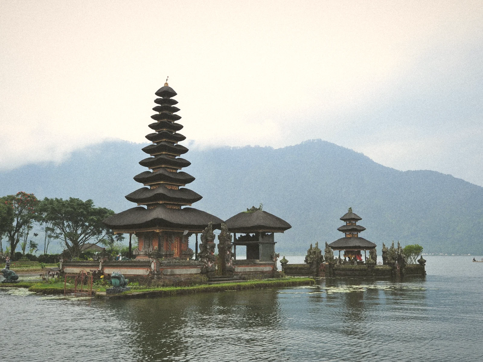 The tiered shrines of Pura Ulun Danu Bratan on Lake Bratan with misty mountains