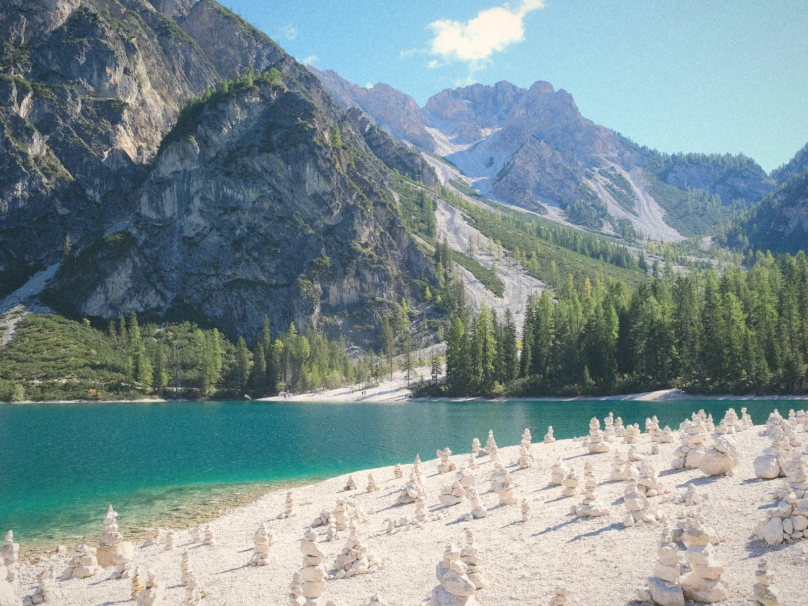 Emerald water of Lago di Braies beneath pale Dolomite peaks
