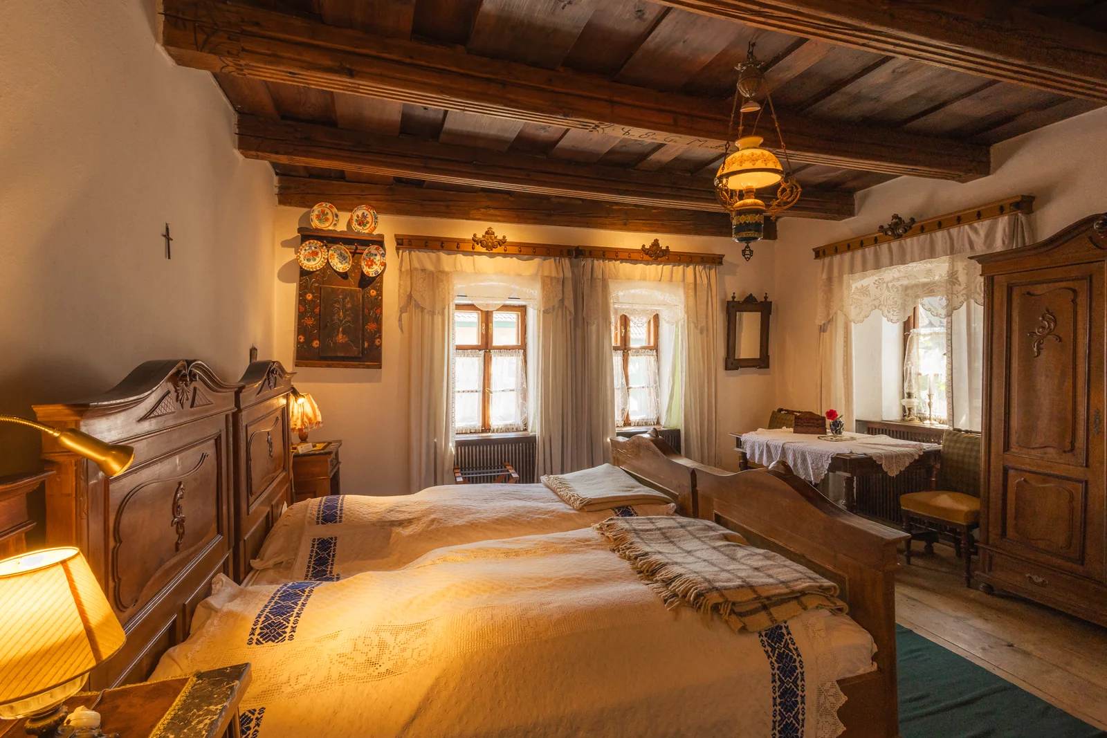The Count's room, with a wooden bed, antique furniture, beamed ceiling and small windows