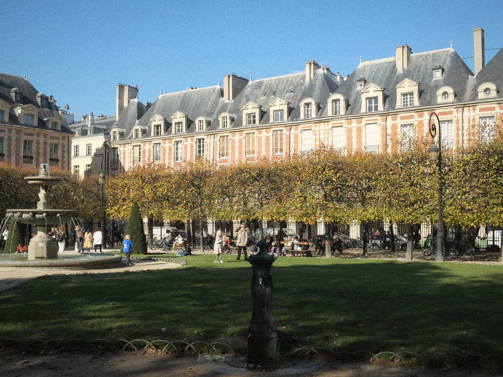 Red-brick arcaded houses around the gardens of Place des Vosges