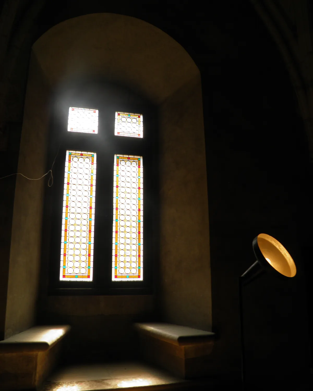 The vaulted Knights' Hall at Corvin Castle, light falling through tall windows