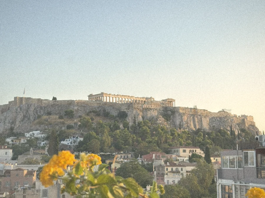 The Acropolis and Parthenon at golden hour above the rooftops of Athens