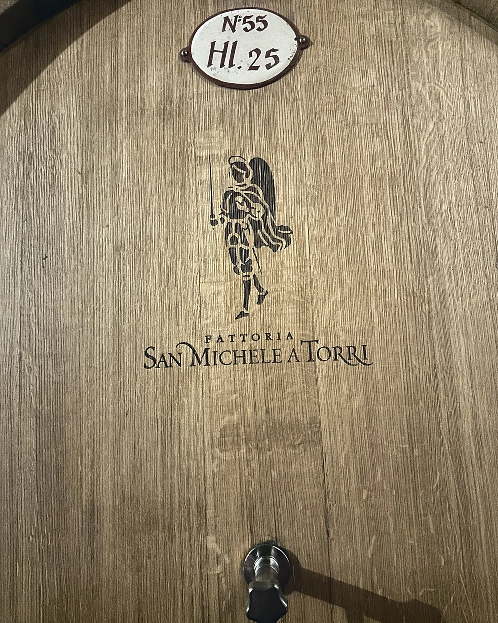 An oak barrel stamped Fattoria San Michele a Torri