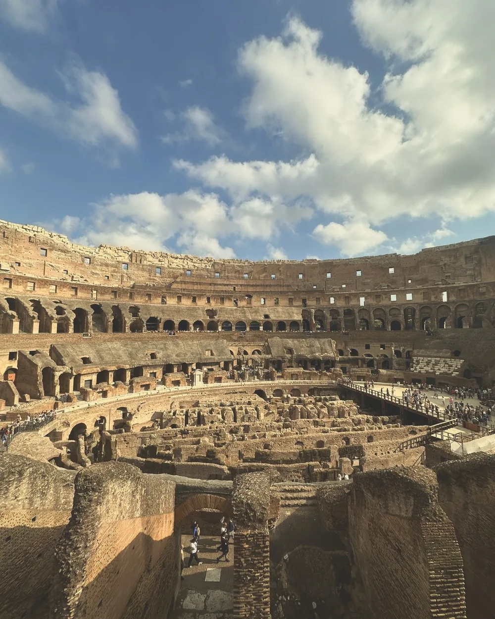 Looking down into the Colosseum's underground passages from the arena level