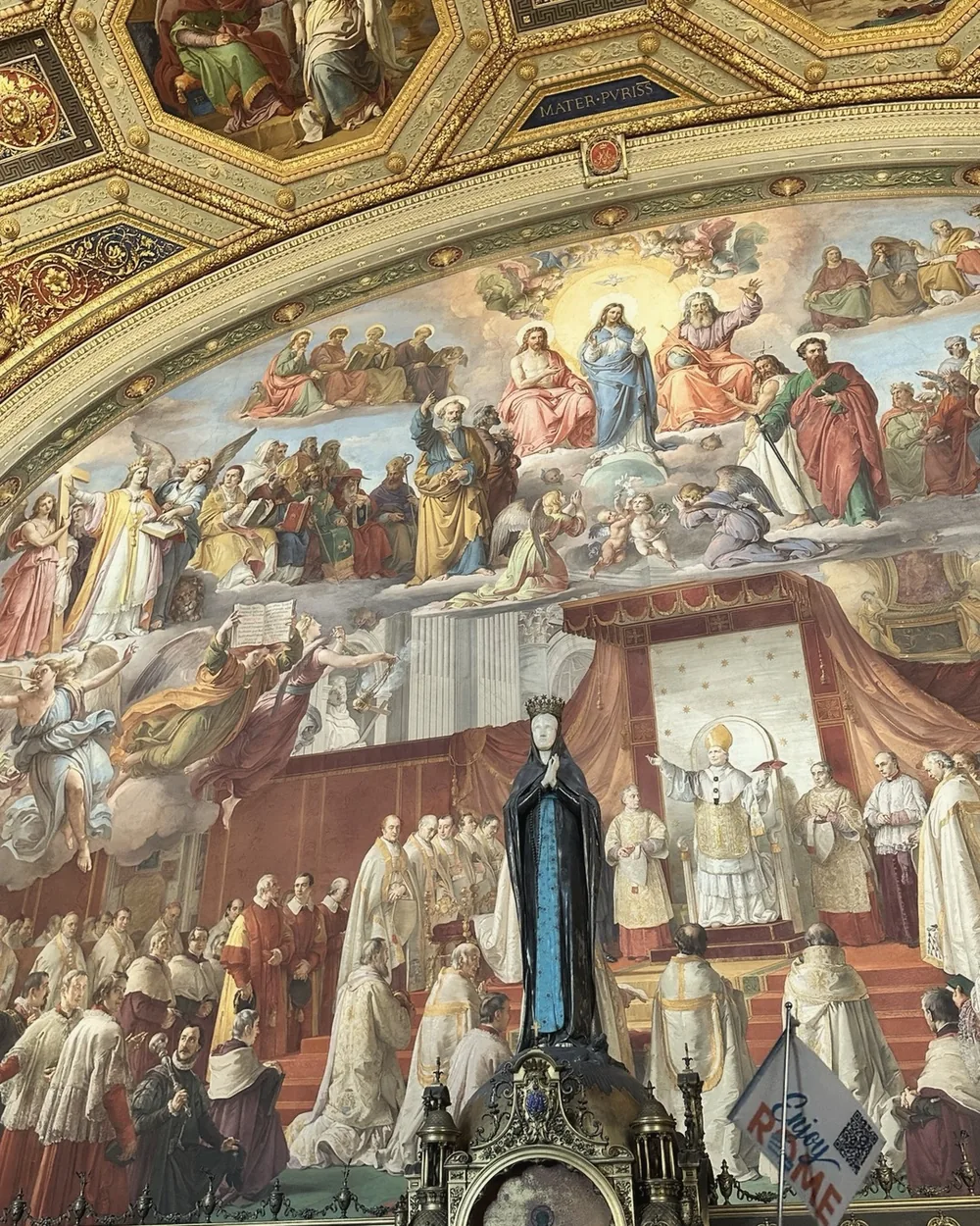 A hall covered in colourful Renaissance frescoes in the Vatican Museums