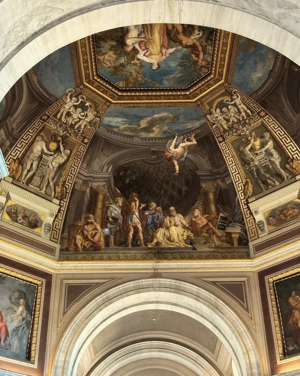A frescoed and gilded ceiling arch in the Vatican Museums