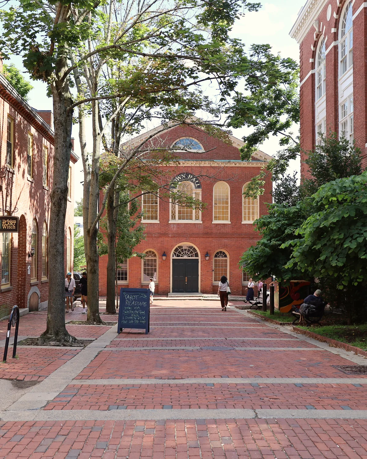 Salem's red-brick Old Town Hall at the end of a brick-paved square lined with trees